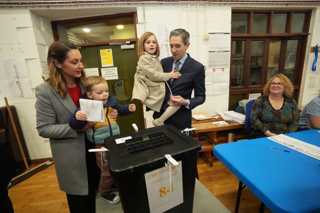 Taoiseach and Fine Gael leader Simon Harris accompanied by his wife Caoimhe and children Cillian and Saoirse as he casts his vote at Delgany National School, Co Wicklow