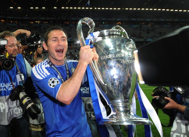 Frank Lampard celebrates with the Champions League trophy (PA)