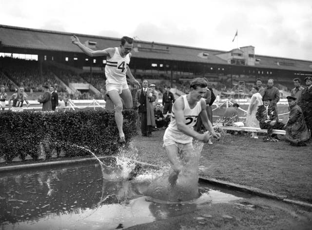 John Disley leads Chris Brasher over the water jump on the last lap of the 3,000-metre steeplechase in 1956 at White City