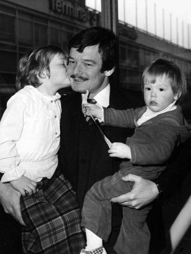 Robin Jackman kisses daughter Debbie and Leigh goodbye at Heathrow Airport before he leaves for the West Indies