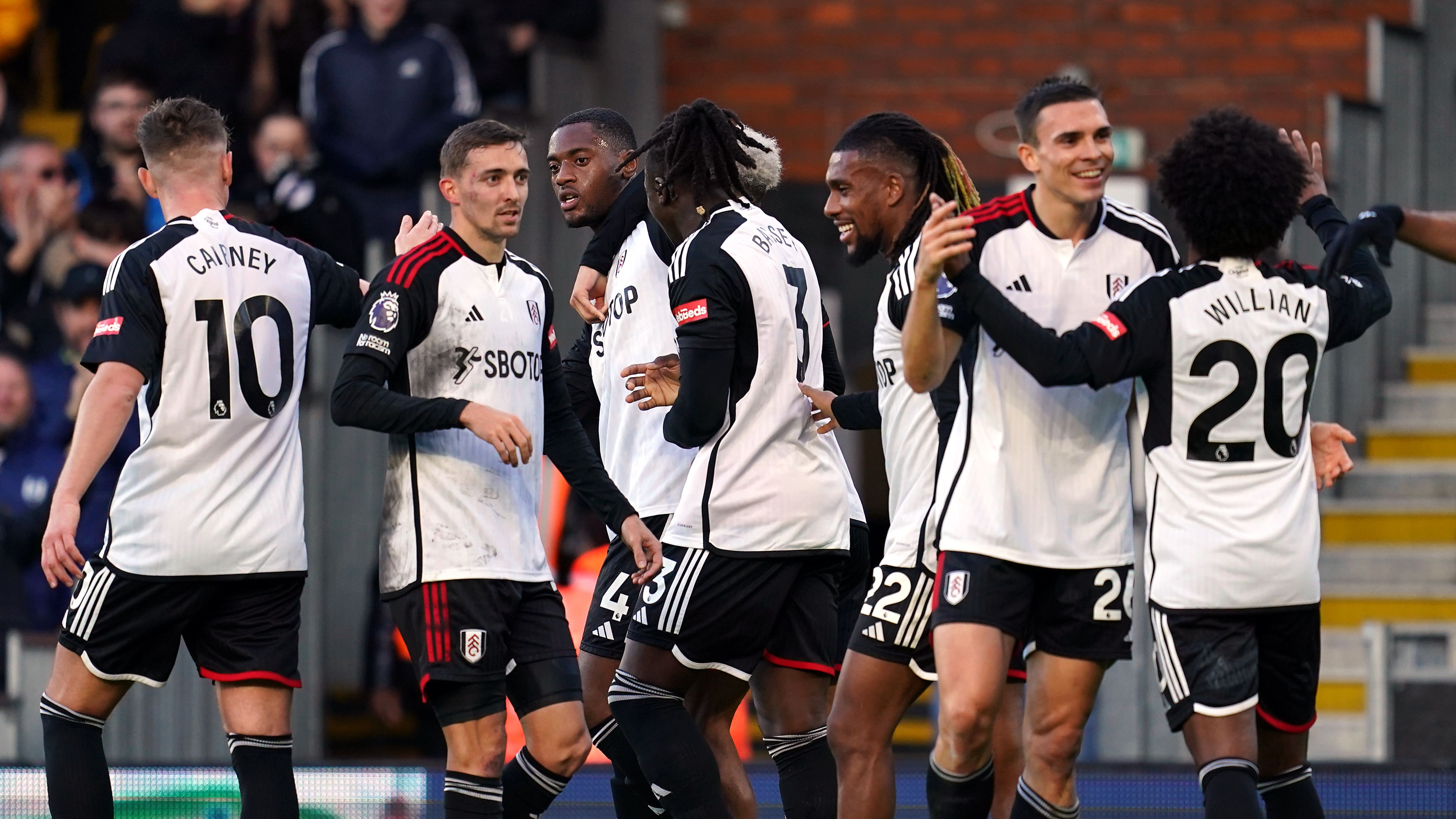 Tosin Adarabioyo (third left) celebrates scoring Fulham’s third goal (Adam Davy/PA)