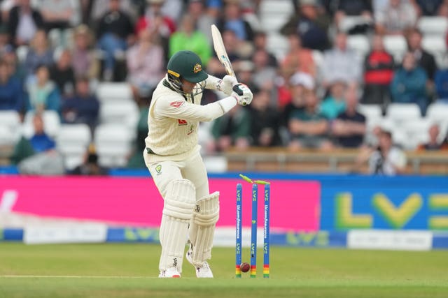 Alex Carey plays on to his stumps