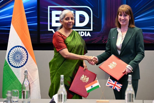 India's finance minister Nirmala Sitharaman, left, shaking hands with Rachel Reeves