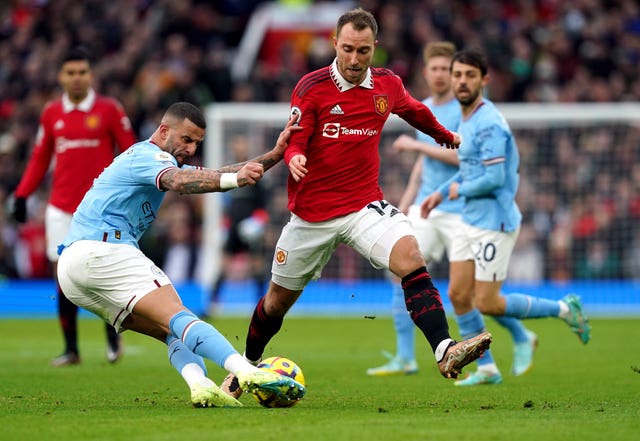 Manchester United’s Christian Eriksen (right) and Manchester City’s Kyle Walker battle for the ball during a Premier League match