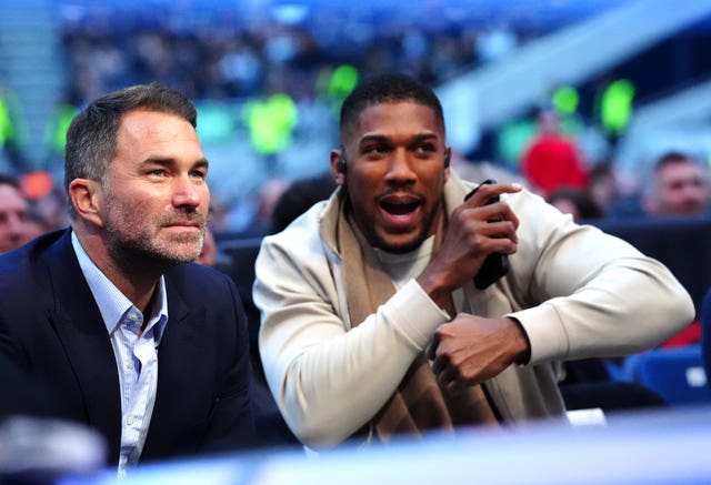 Anthony Joshua, right, and his promoter Eddie Hearn look on at a Tyson Fury fight in April 2026