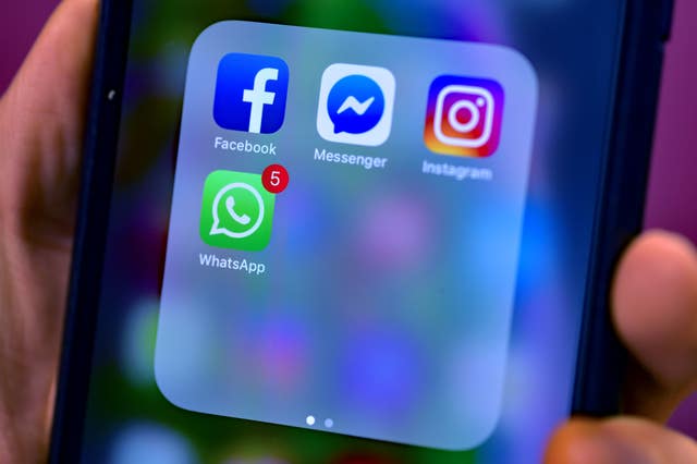 Stock photo of Facebook, Messenger, Instagram and WhatsApp, social media app icons on a smart phone.