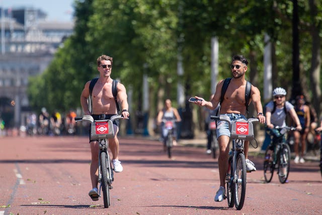 Cyclists ride along The Mall in London (Dominic Lipinski/PA)