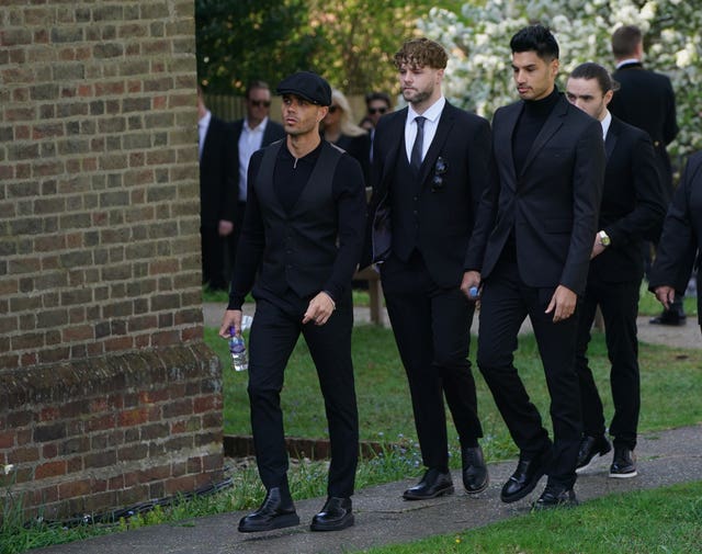 The members of The Wanted (from left) Max George, Jay McGuiness, Siva Kaneswaran and Nathan Sykes (partially hidden) arrive for the funeral 