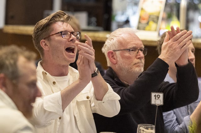 Holywood Golf Club members watch the final day of the US Masters 2026
