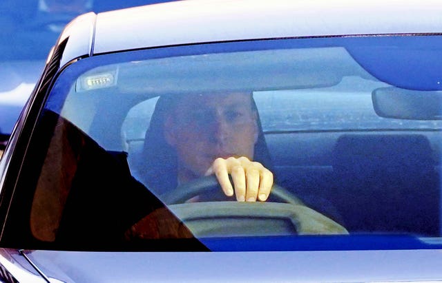 A serious looking Prince of Wales drives away from The London Clinic where Kate was being treated