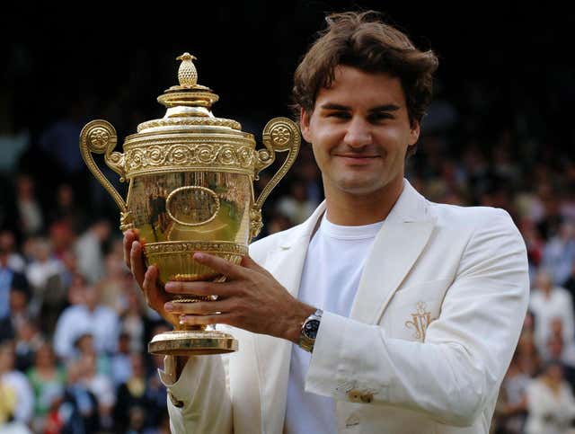 Federer lifts the Wimbledon trophy again in 2006 after beating Rafael Nadal