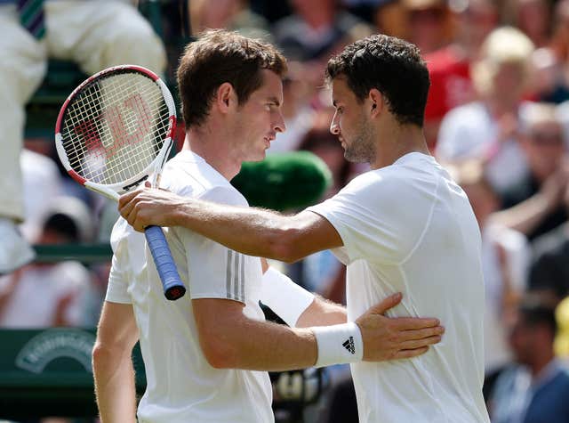 Grigor Dimitrov is congratulated on his win by Great Britain’s Andy Murray 