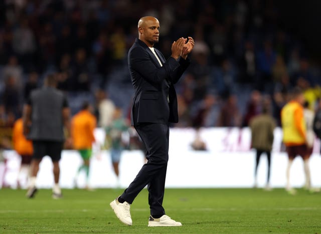 Burnley manager Vincent Kompany applauds the fans