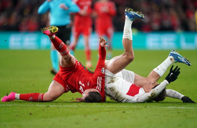 Connor Roberts (left) collides with Turkey’s Kenan Yildiz