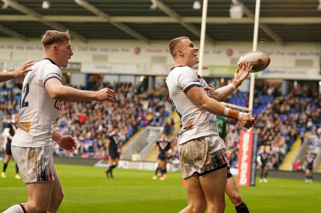 England’s Ash Handley (right) celebrates one of his three tries