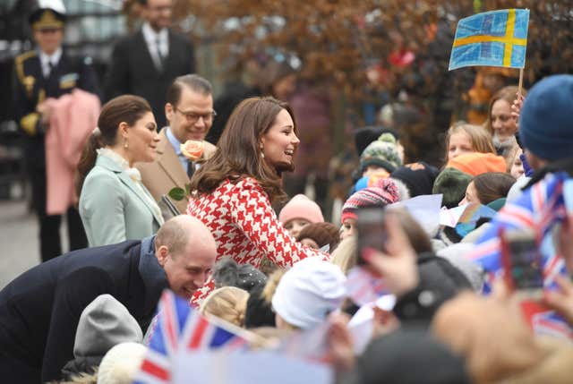 William and Kate, accompanied by Crown Princess Victoria and Prince Daniel of Sweden, outside the Matteusskolan school (Victoria Jones/PA)