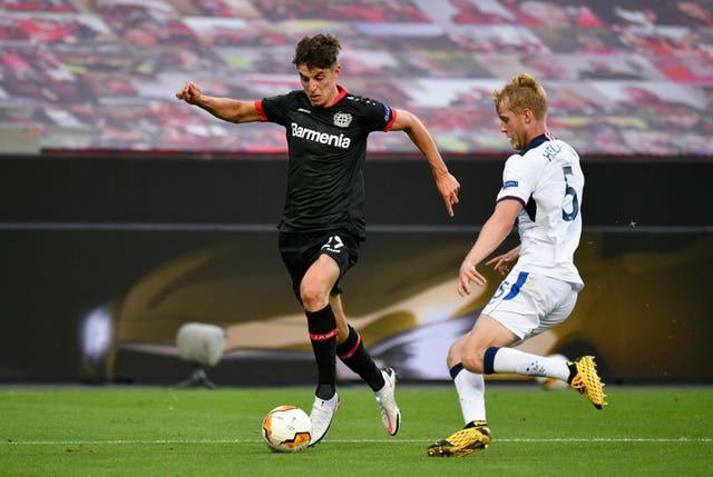 Bayer Leverkusen’s Kai Havertz (left) and Rangers’ Filip Helander battle for the ball