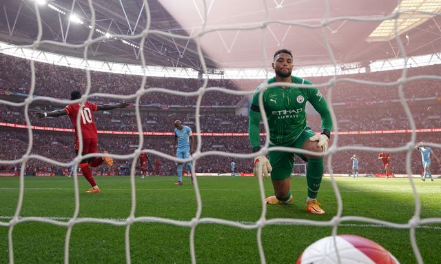 Manchester City goalkeeper Zack Steffen looks dejected after conceding in the FA Cup semi-final against Liverpool