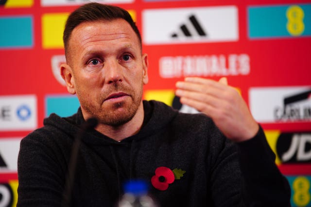 Wales boss Craig Bellamy talks to the media