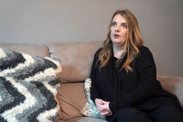 Louise Longster sitting on a sofa