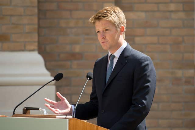 Hugh Grosvenor, the 7th Duke of Westminster, standing behind a lectern as he makes a speech